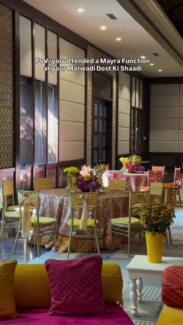 Lounge seating dressed in pink cushions and layered rugs